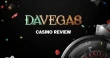 DaVegas casino review banner with roulette wheel, playing cards and colorful casino chips on a dark black casino background.