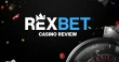Rexbet casino review banner with roulette wheel, playing cards and colorful casino chips on a dark black background.